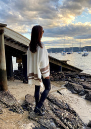 The Layla Slouch Jumper by Bagira is a stunning oversized knitted jumper in a gorgeous cream and caramel cotton blend. The casual slouch style is both sassy and classy at once, this jumper has a trendy street credability. With wide sleeves and extra long panels at the back, it is casual and feminine and looks fabulous paired with jeans, leather pants, leggings, or a mini and high boots